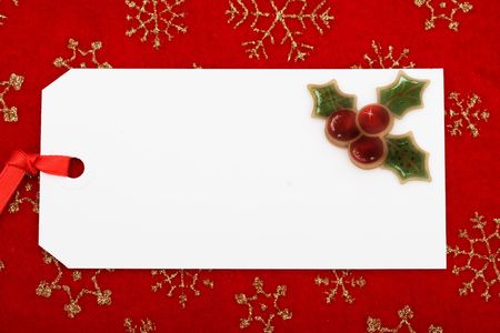 A blank gift tag on a red snowflake background, Christmas giftの写真素材