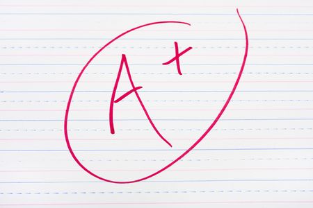 A letter grade written on lined paper, good gradesの写真素材