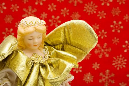 A Christmas angel on a red snowflake background, snowmanの写真素材