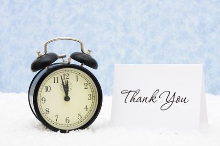 A retro clock with a thank you card snowflake background, thank you