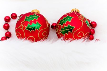 Red glass Christmas balls on a white furry background, Christmas ballsの写真素材