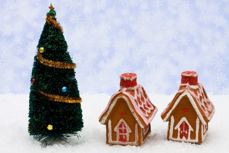 A Christmas tree with gingerbread houses on a snowflake background, Christmas treeの写真素材
