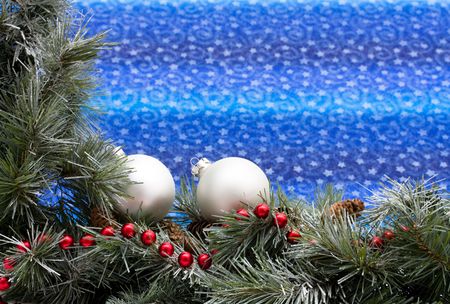 A green garland border on a blue background