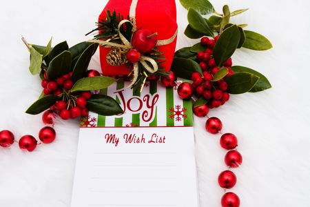 A blank notepad with the word joy on a white fur backgroundの写真素材