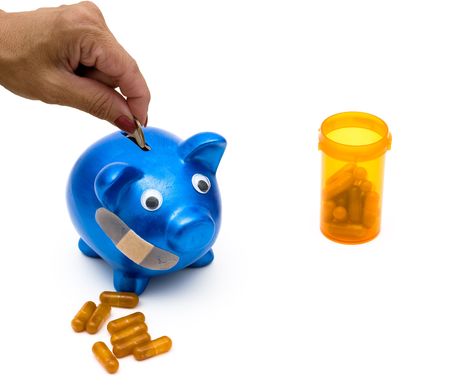 Piggy bank with a bandage over it on a white background, medication costsの写真素材