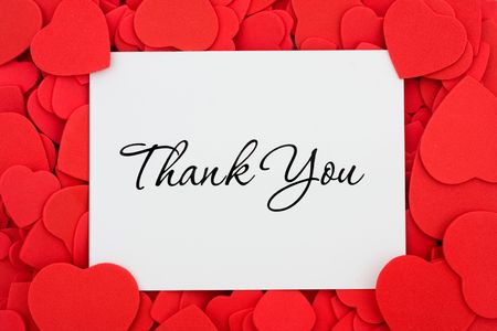 A thank you card on a red heart background, thank youの写真素材
