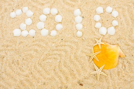 Seashells making a date in the sand, vacation 2010の写真素材
