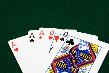 A full house sitting on a green background, full houseのeditorial素材