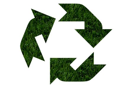 The recycling symbol in green grass isolated on white background, Environment friendlyの写真素材