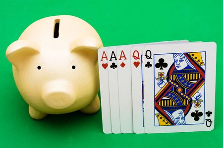 Full House cards with a piggy bank on a  green background, playing poker