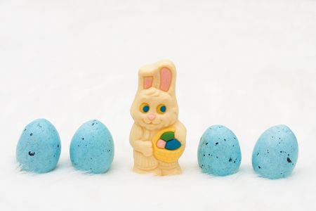 Easter eggs in a row with an Easter bunny on a white background, Happy Easterの写真素材