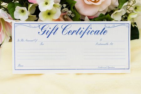 A bouquet of flowers with a gift certificate, give a gift certificateの写真素材