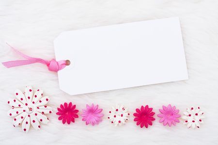 A pink flowers making a border on a white background, pink flower borderの写真素材