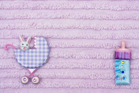 Baby background with a stroller and baby bottle, Welcoming a new babyの写真素材