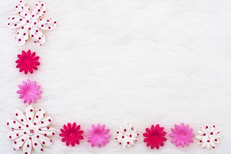 A pink flowers making a border on a white background, pink flower borderの写真素材