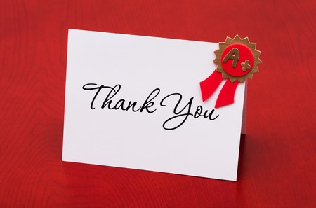 A thank you card with an A+ on a red background, thank you award
