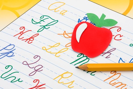 A book with the alphabet on it with a pencil, school workの写真素材