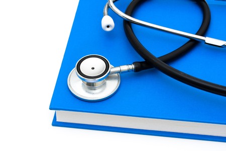 A stethoscope on a book isolated on a white background, stethoscopeの写真素材