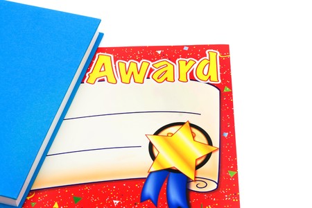 A book with a paper award isolated on a white background, education awardの写真素材