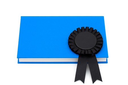 Black ribbon reward on a book isolated on white, Education rewardsの写真素材
