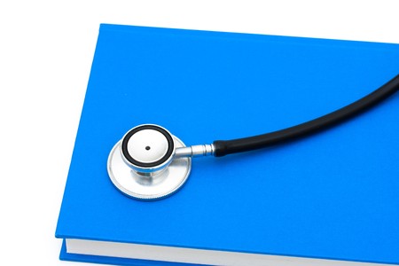 A stethoscope on a book isolated on a white background, stethoscopeの写真素材