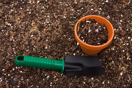 A gardening shovel on a soil background, gardening shovelの写真素材