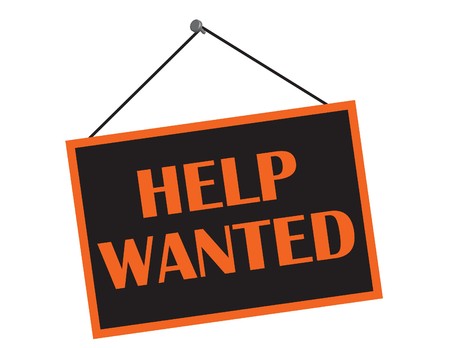 A black and orange help wanted sign with copy spaceの写真素材