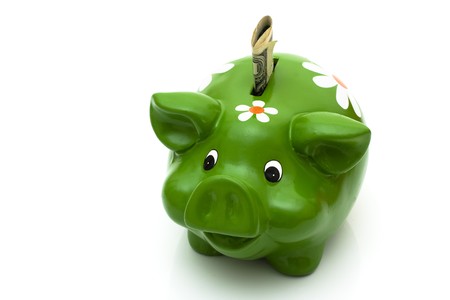 Piggy bank isolated on white with dollar bill in it, Saving you moneyの写真素材