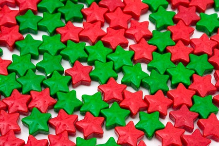 Red and green stars making a background isolated on white, star backgroundの写真素材