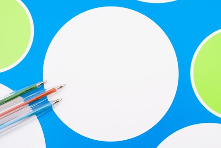 Some colored pens on a patterned background, back to schoolの写真素材