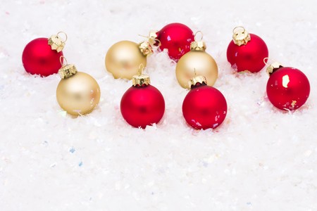Red and gold glass Christmas balls on a white background, red glass ballsの写真素材