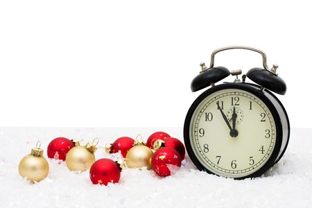 Red and gold glass Christmas balls with an alarm clock on a white background, Christmas Time