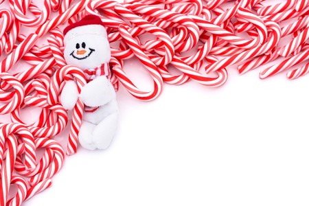 Mini candy canes making a border on a white background, Candy cane borderの写真素材