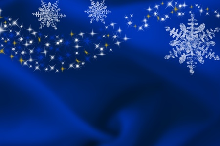snowflakes on a blue background with copy spaceの写真素材