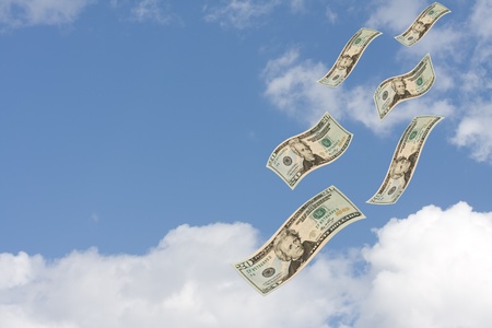 Twenty dollar bills floating through a cloudy sky, Raining Moneyの写真素材