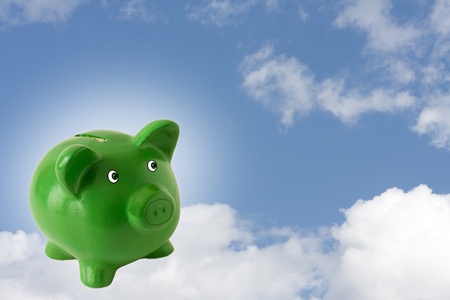 A green piggy bank on a sky background, Your Financial Dreamsの写真素材