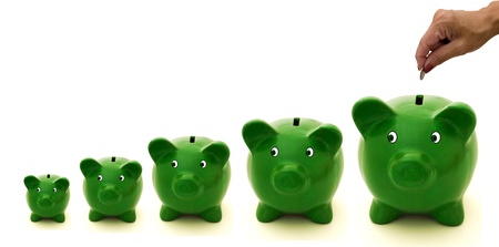 A row of green piggy bank with a white background, Investingの写真素材