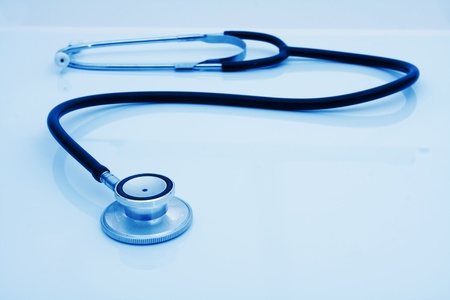A stethoscope isolated on a blue background, Health checkups
