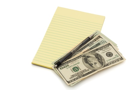 A notepad and pen with some American money isolated on white, Budgeting your moneyの写真素材