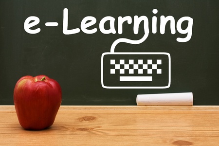 A chalkboard and chalk with text of e-learning and drawing of a computer keyboard, E-learningの写真素材