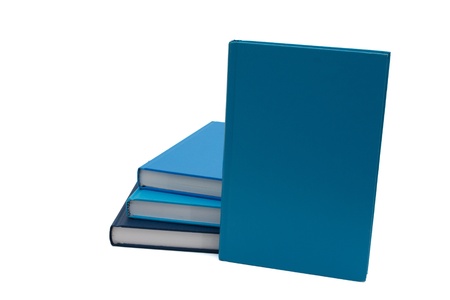 A Stack of blue books with one standing up to place your message, isolated on a white backgroundの写真素材