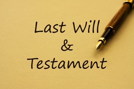 A fountain pen with yellow paper and words last will and testamentの写真素材