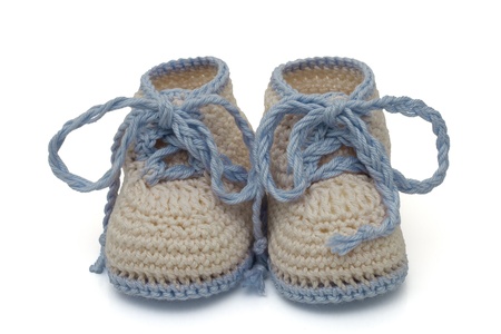 Blue and Ecru crochet baby booties isolated on white, Hand-made baby booties