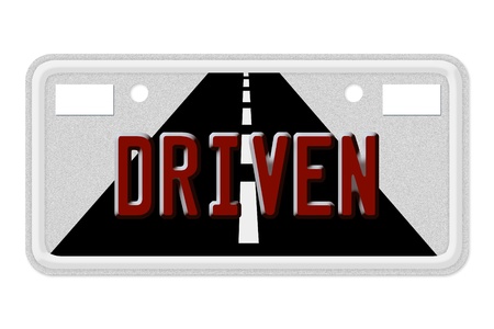 The words Driven on a gray license plate isolated on whiteの写真素材