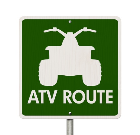 An American road sign isolated on white with a symbol of an ATV and words ATV Route, Places to ride...