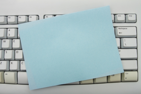 Computer keyboard keys with blank card with copy space, Create your own online messageの写真素材