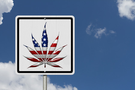 Driving Under the Influence of  Marijuana, A road highway sign with a marijuana leaf in USA flag colors with sky backgroundの写真素材