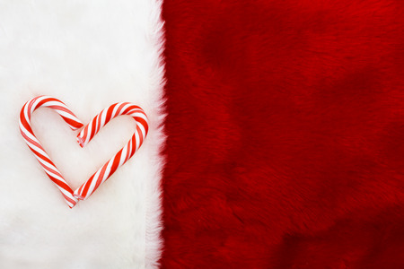 Holiday Background, A plush red stocking with a Candy Canes Heart with copy-spaceの写真素材