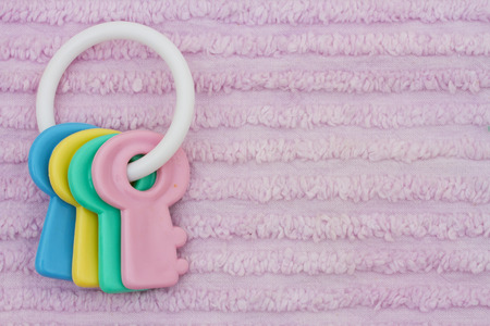 Baby Background, Baby Toy on a pink chenille background with copy-space for your messageの写真素材