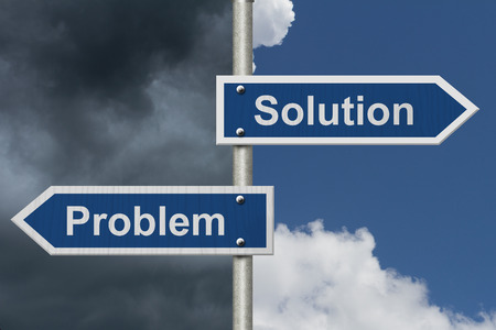 Finding Solutions for your Problems, Two Blue Road Sign with text Problem and Solution with bright and stormy sky backgroundの写真素材